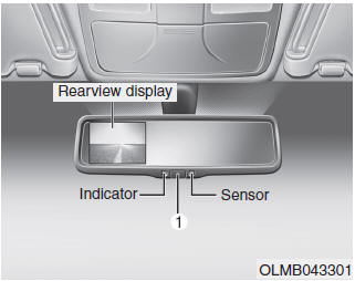 Hyundai Tucson: Mirrors. To operate the electric rearview mirror: