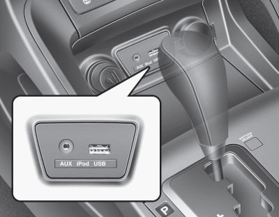 Hyundai Tucson: Audio system. If your vehicle has an aux and/or USB(universal serial bus) port or iPod port,