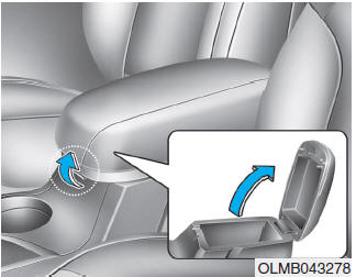 Hyundai Tucson: Storage compartments. To open the center console storage: Pull up the lever.