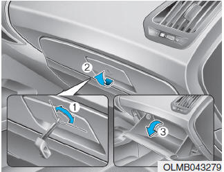 Hyundai Tucson: Storage compartments. The glove box can be locked and unlocked with a key. (1)