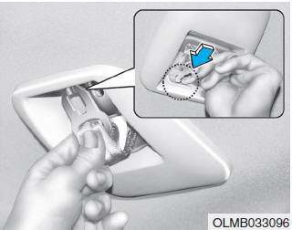 Hyundai Tucson: Seat belt warning light. 3. Insert the metal tab into the hole of the belt assembly cover.